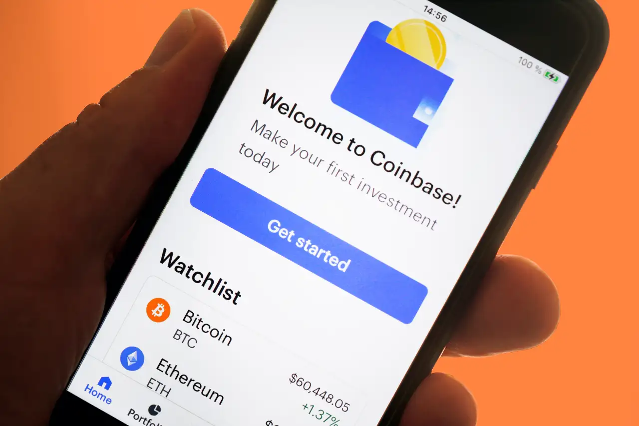 Phone displaying Coinbase app interface with Base token trading options for instant DEX trading